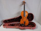 a violin that is sitting in a case on a table