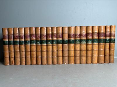 a stack of old books sitting on top of a table