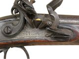 a close up of a gun that is on a white background