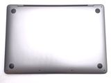 a close up of a silver laptop computer on a white surface