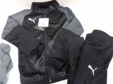 a black and gray jacket, pants, and socks