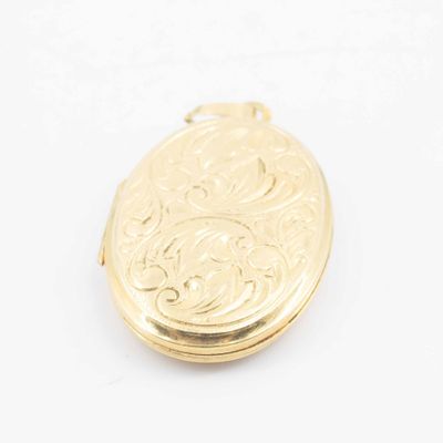 an image of a gold locke with a floral design on it