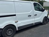 a white van that is parked on the side of the road