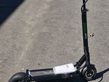 a scooter that is sitting on the pavement