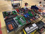 a table with many tools on it in a warehouse