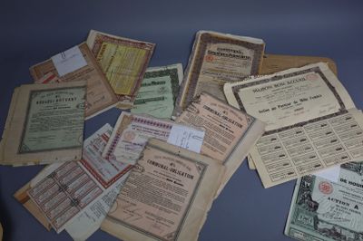 a lot of old papers on a blue table