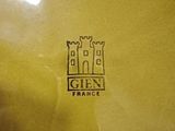 a yellow plate that has a picture of a castle on it