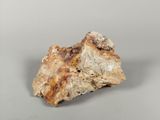 an image of a piece of rock on a gray surface