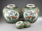 two vases sitting next to each other on a table