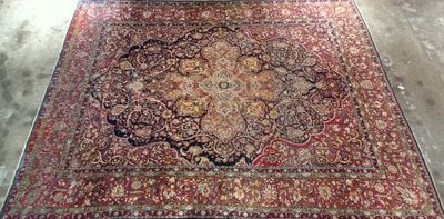 an image of a large oriental rug in a room