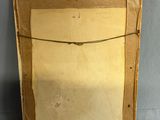 an old picture frame with a piece of paper hanging from it ' s side