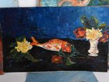 a painting of a fish and flowers on a table