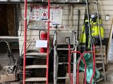 a lot of tools that are sitting outside of a building