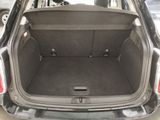 the back of a car with its trunk open and the back seats folded down