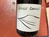 a bottle of wine that is being held by a person