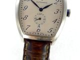 a close up of a wrist watch with a brown leather strap
