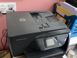 a printer that is sitting on top of a desk