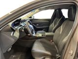 the interior of a car with the door open showing the driver ' s seat area