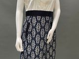 a mannequin wearing a black and white patterned dress