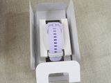 a white box with a purple watch inside of it