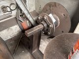 an image of a machine that is working on a piece of metal