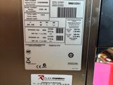 a label on the side of a stainless steel refrigerator