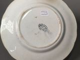 a white plate with a black and white design on it