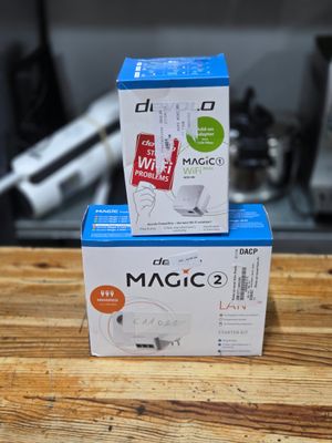 two boxes of magic 2 are stacked on top of each other on a table