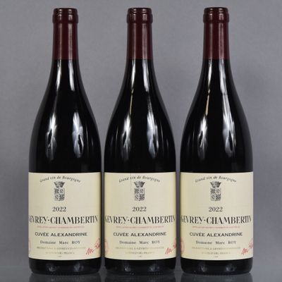 three bottles of wine sitting on top of a table next to each other