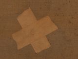 a piece of brown paper with a cross on it
