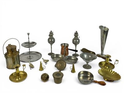 many different types of silverware on a white surface