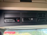 a picture of a car dashboard with a car radio and other electronics