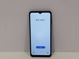 an iphone is sitting on top of a table with a message on the screen