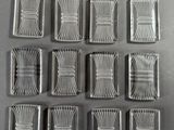 six plateaux carrés plaqués argent, ornés d'un motif