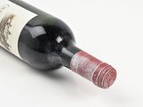 a bottle of wine that is sitting on a table