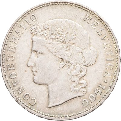 a close up of a coin with a woman ' s head on it