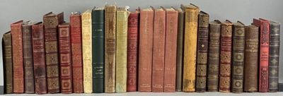 a lot of books that are sitting on a shelf