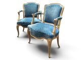 une paire de fauteuils rembourrés bleus sur fond blanc