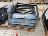 a pile of luggage sitting on a pallet in a warehouse