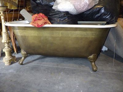 a bathtub with a lot of garbage in it