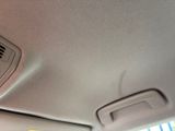 a fan in the center of a car ' s ceiling