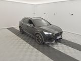 the grey car is parked in the garage on the checkered floor