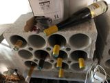 many bottles of wine sitting in a wine rack