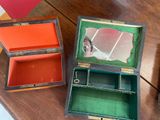 two boxes that are sitting on a wooden table