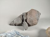 a rock that is sitting on a table next to other rocks