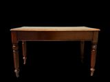 a wooden table with a wooden top on a black background