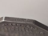 a close up of a metal object on a table