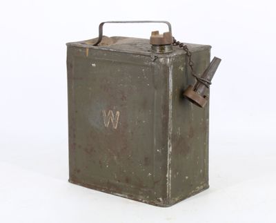 an old metal box with a handle and a tag on it
