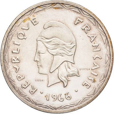 a close up of a coin with a woman ' s face on it