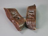 two pieces of wood that are sitting on a table